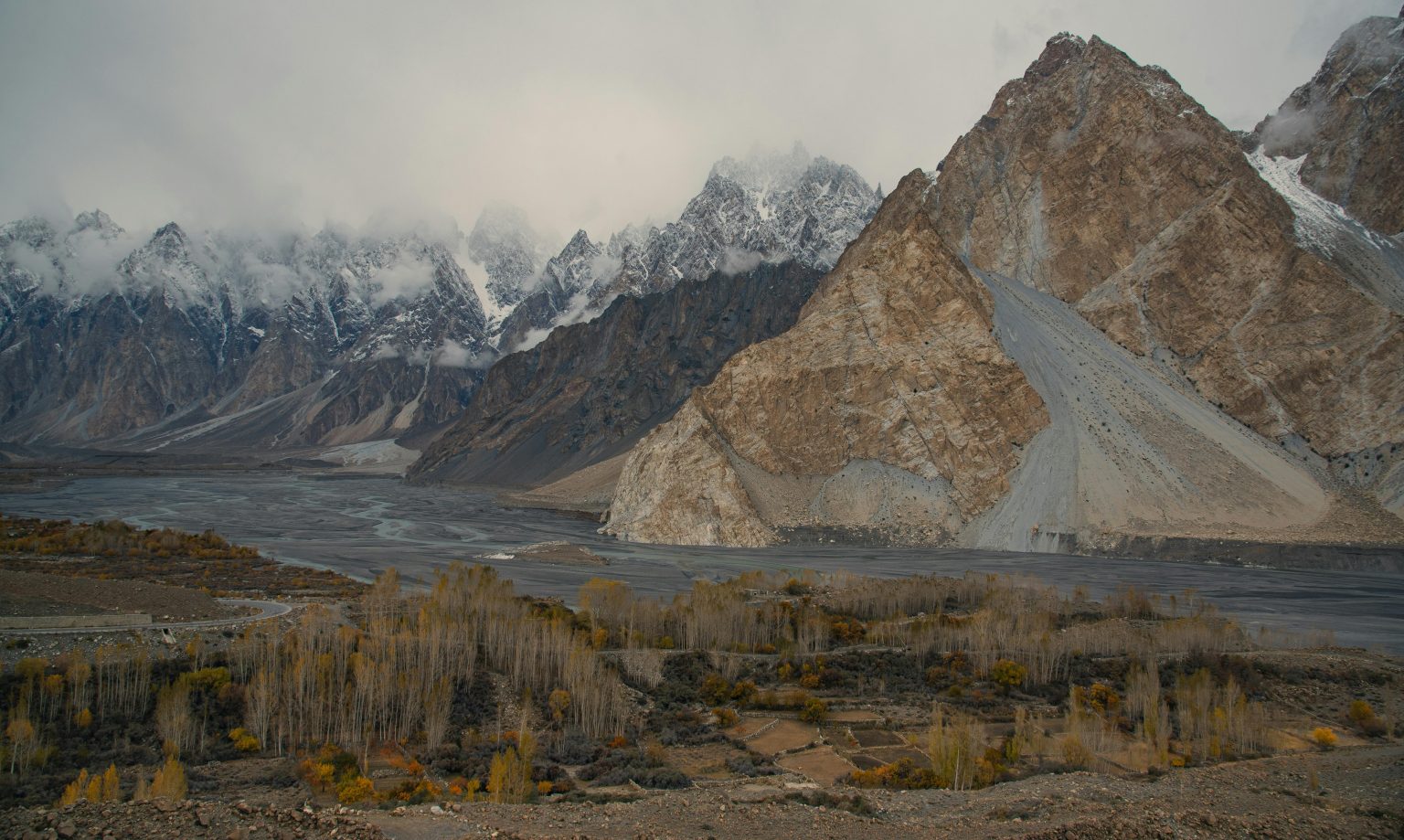 Discover Hunza Nagar's breathtaking valley with towering rugged mountains.